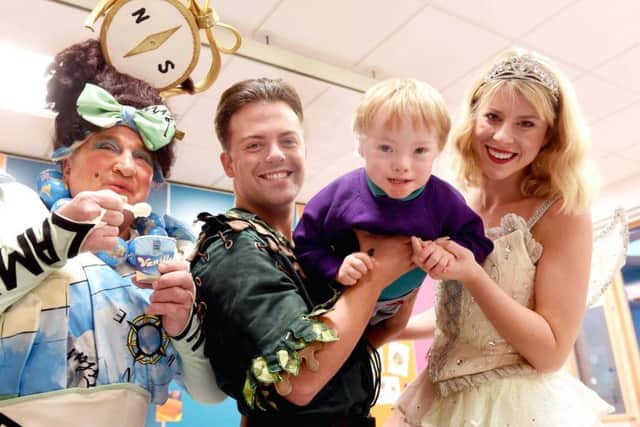 Cooper, 3, from Donaghadee  taking flight with legendary local panto star May McFettridge, Peter Pan (Mikey Jay-Heath) and Tinkerbell (Hollie ODonoghue)