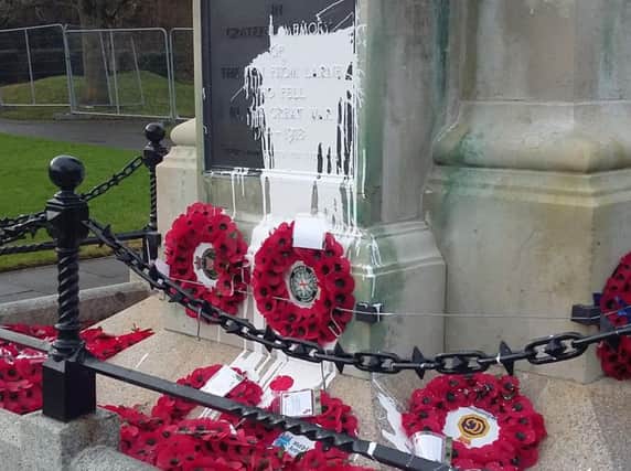 Paint daubed on Larne War Memorial.