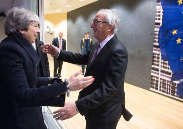 EU President Jean-Claude Juncker greeting British Prime Minister Theresa May at the EU Commission in Brussels. Photo: Etienne Ansotte/EU/PA Wire
