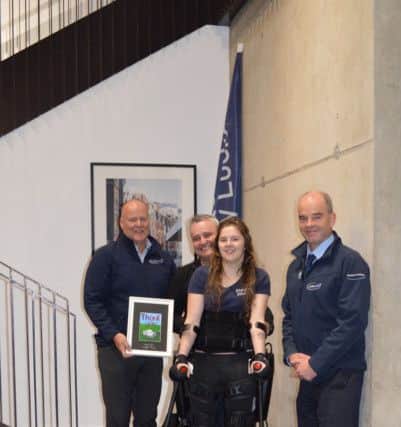 Jennifer Smyth trials her new ReWalk exoskeleton, donated by Landmarc Support Services