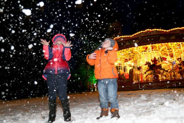 Ella and Bobby McMullan from Aghalee have fun in the snow at the Enchanted Winter Garden which opened on Saturday in Antrim's Castle Gardens. Photo: Stephen Davison, Pacemaker.