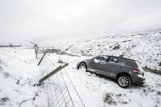 An abandoned car on the roadside on the Snake Pass in the Peak District. Photo: Danny Lawson/PA Wire