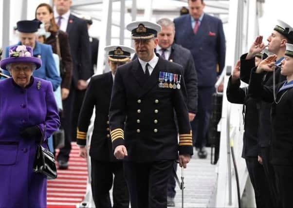 Philip Crozier (far right, middle) pipes Her Majesty The Queen aboard her namesake vessel during the ceremony.  INCT 51-722-CON