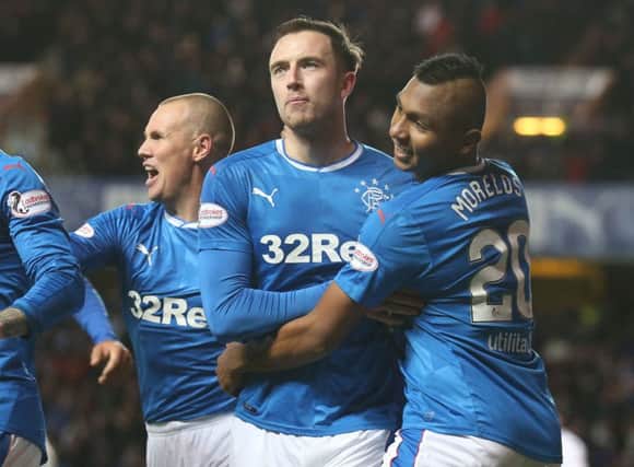 Rangers' Danny Wilson (centre) celebrates scoring his side's second goal against Ross County
