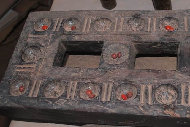 Pallankuli or Pallanghuzi. an ancient Tamil board game