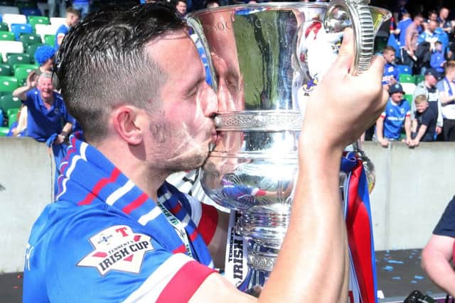 Linfield's Andrew Waterworth pictured celebrating his side's Irish Cup win in May.