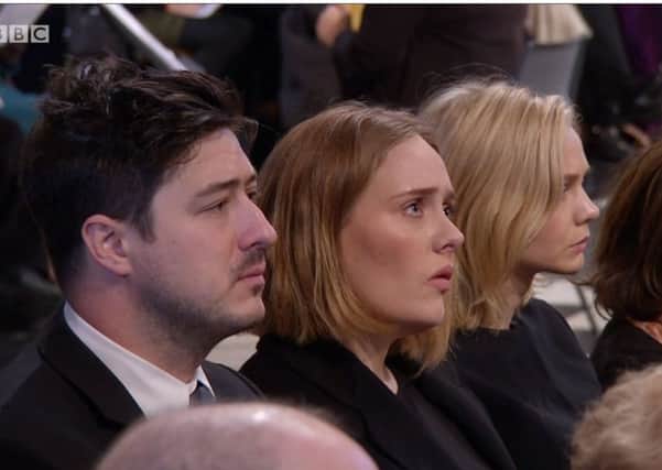 (from left) Marcus Mumford, Adele and Carey Mulligan attending the Grenfell Tower National Memorial Service at St Paul's Cathedral in London, to mark the six-month anniversary of the Grenfell Tower fire. Image BBC / PA