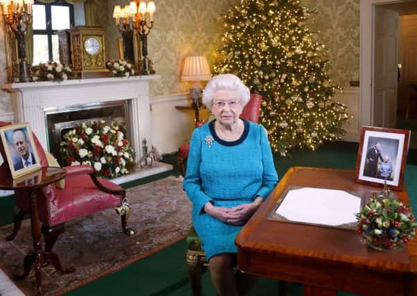 Queen Elizabeth II recording her Christmas Day message to the Commonwealth in the Regency Room at Buckingham Palace in 1999. PA