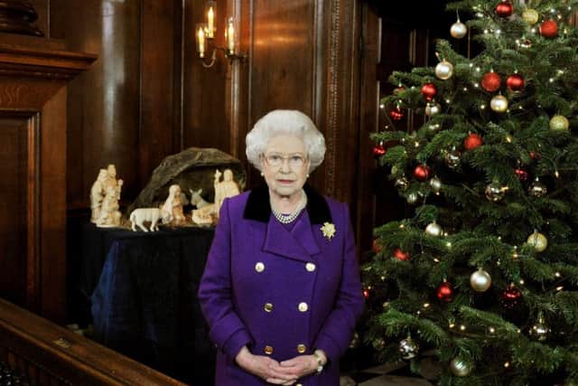Queen Elizabeth II recording her Christmas Day message to the Commonwealth in the Chapel Royal at Hampton Court Palace in 2010. PA