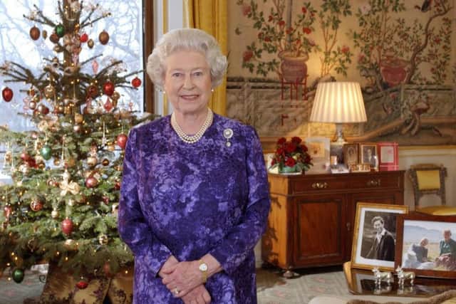 Queen Elizabeth II recording her Christmas Day message to the Commonwealth in the Yellow Drawing Room at Buckingham Palace in 2004. PA