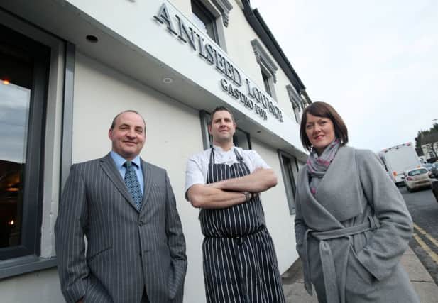 Derick Wilson from Ulster Bank with Nick and Joanne Clough of Aniseed