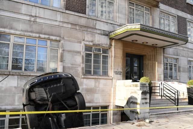 A Mercedes C Class car which crashed through some railings into the basement of a luxury apartment block at Lancaster Terrace, London.
