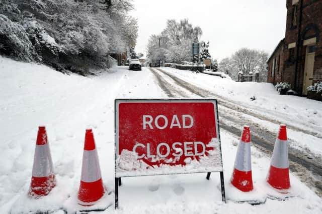The snow caused travel disruption across England. Above a road closed sign in snow covered Ironbridge in Shropshire on Sunday December 10. Photo: Nick Potts/PA Wire