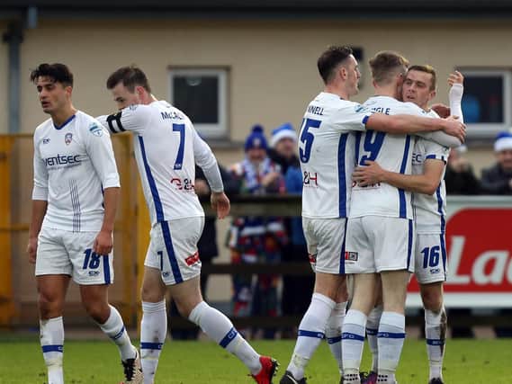 Ian Parkhill celebrates his opener for Coleraine at Ferney Park.