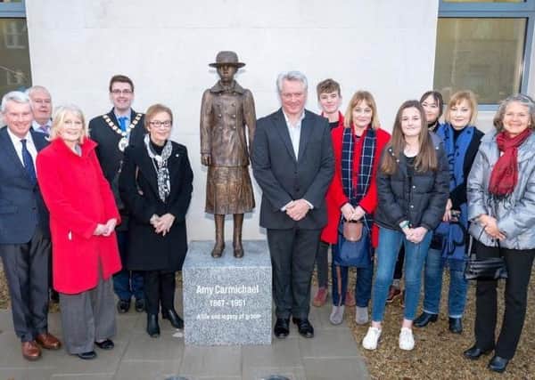 A bronze sculpture of Amy Carmichael created by Coleraine artist Ross Wilson was unveiled by Margaret Bingham, wife of the late Derek Bingham. Pictured are members of the Bingham family with left, Rev David Johnston, minister of Hamilton Road Presbyterian Church, councillor Bill Keery, Lesley Stewart from Bangor Worldwide Missionary Convention, Ards and North Down Mayor Robert Adair, Margaret Bingham and Ross Wilson. Also pictured far right is Valerie Elliot Shepherd, daughter of Elisabeth Elliot who wrote a biography of Amy Carmichael.