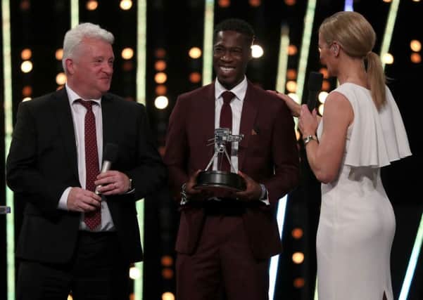 Stephen Maguire (left) and Christian Malcolm (centre) receive the coach of the the year during the BBC Sports Personality of the Year 2017 at the Liverpool Echo Arena.