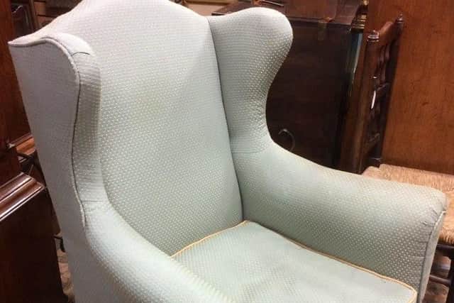 The wingback chair said to have been used by Winston Churchill during his visits to Harrow School