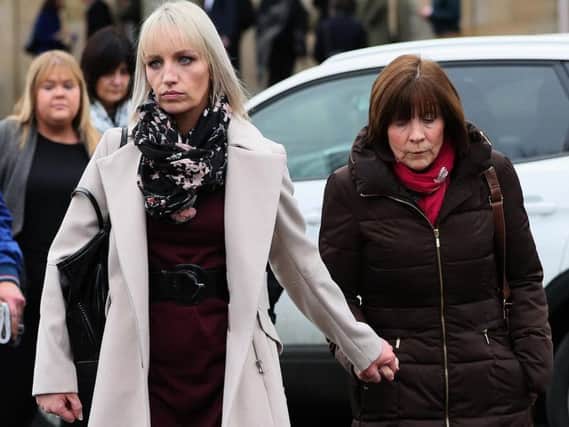 Clodagh Hawe's mother Mary Coll (right) and sister Jacqueline Connelly leaving Cavan Court House following the inquest into the deaths of the Hawe family last year