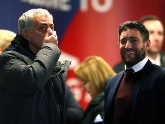 Manchester United manager Jose Mourinho (left) and Bristol City manager Lee Johnson
