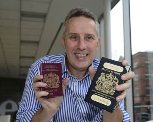 Ian Paisley Jr pictured with his new and old passport.
Picture By: Arthur Allison.