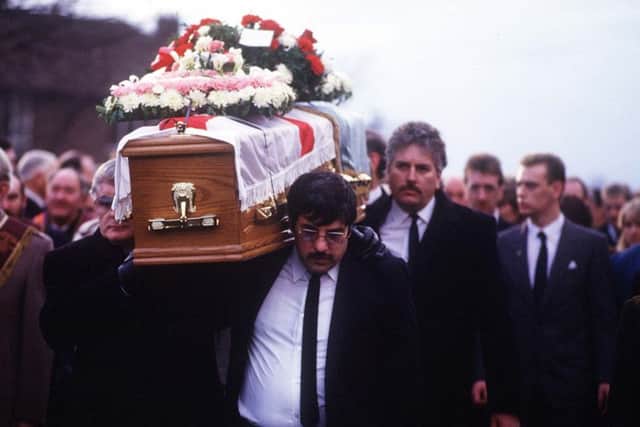 UDA leaders Andy Tyrie (right) and Davy Payne (left) carry the coffin of murdered colleague John McMichael at his funeral in Lisburn 26th December 1987. Photo: Pacemaker.