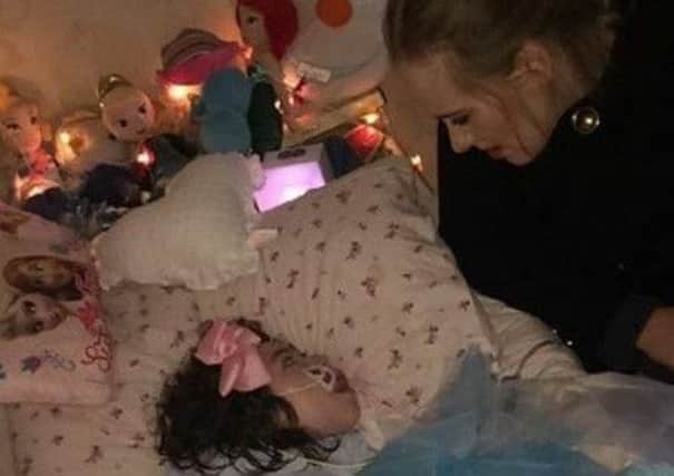 Singer Adele at the bedside of Rebecca Gibney in March last year