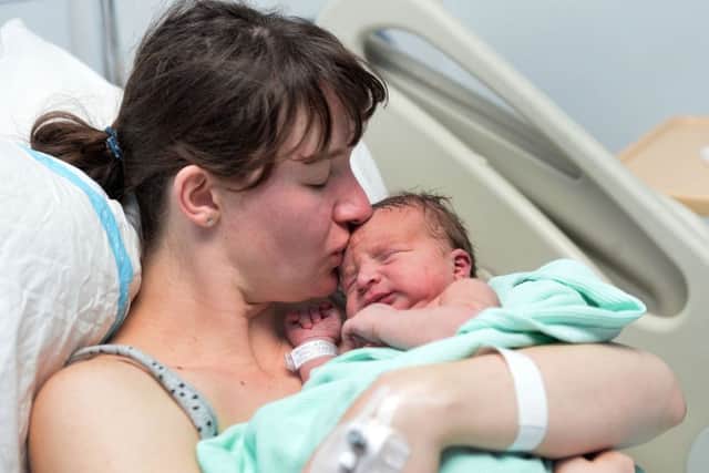New Year's Day baby Eben with mum Sandra Bosse who was born at 3.00am and weighed 9 pound 7 1/2 ounces , at the Royal Victoria Hospital in Belfast. 
Pic Colm Lenaghan/Pacemaker