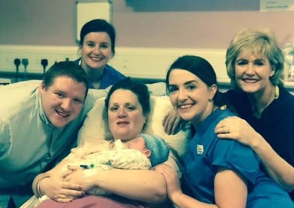 Kyron Gatley - born at 12.03am New Year's Day - with parents Catherine and Nathan and Altnagelvin Hospital staff