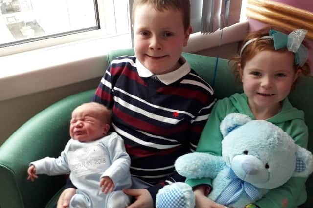 Baby Sam Hyde who was born in Craigavon Hospital with brother James and sister Maggie