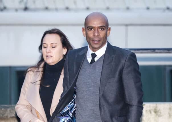 File photo dated 19/12/17 of former footballer Trevor Sinclair arriving at Blackpool Magistrates' Court with his wife Natalie. The former England star will appear in court on Tuesday accused of crimes including assaulting a police officer and a racially aggravated public order offence. PRESS ASSOCIATION Photo. Issue date: Tuesday January 2, 2018. He will appear at Blackpool Magistrates' Court charged with offences of driving while unfit through drink, assault on a police officer, racially or religiously aggravated intentional harassment, alarm or distress, failing to provide a specimen for analysis, criminal damage to property under the value of Â£5,000 and indecent conduct in a police station. See PA story COURTS Sinclair. Photo credit should read: Danny Lawson/PA Wire