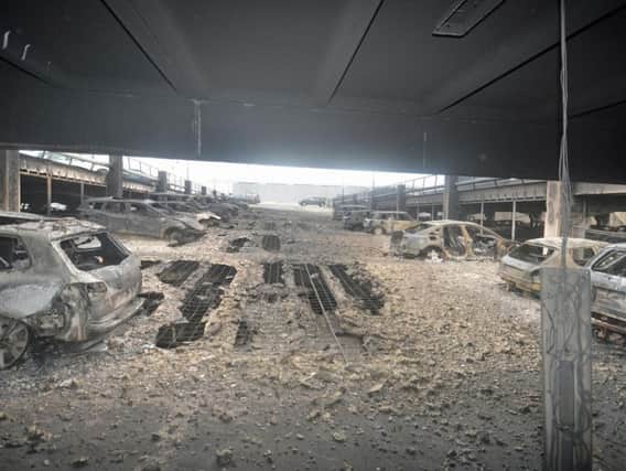 Undated handout photo issued by Merseyside Fire and Rescue Service of the scene after a blaze at a multi-storey car park near to the Echo Arena on Liverpool's waterfront
