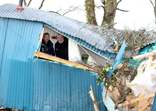 The scene at Mount Stewart after a tree fell overnight due to Storm Eleanor with after winds gusting up to 100 miles per hour have caused flooding, damage to buildings and travel disruption across Northern Ireland.

Andrew Upton and Barry Kelly from National Trust Mount Stewart standing inside the Shepherds hut that was destroyed 

Picture by Matt Mackey / Presseye.com