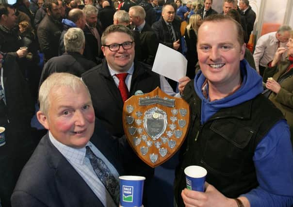 Pictured presenting the Promar Dairy Farmer of the Year Shield to Roger McCracken are (left to right) John Dunlop, chairman of Dale Farm, and Michael Calvert, Promar dairy consultant