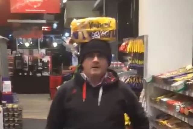 Sinn Fein MP Barry McElduff with a Kingsmill-branded loaf on his head on the anniversary of the Kingsmill massacre