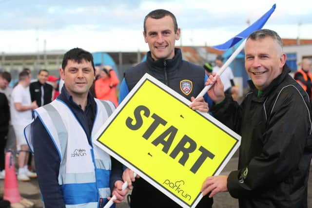 Coleraine FC manager Oran Kearney (centre) starts the Magilligan Prison park run on Saturday along with Colin Rice, run organiser, and Gary Milling, governor, Magilligan Prison