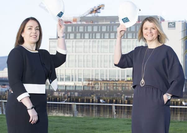 AC Marriott Belfast manager Lisa Steele, pictured across the river from the new hotel with head of sales Amanda McBride