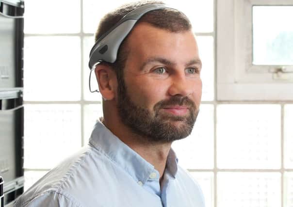 Neurovalens CEO Dr Jason McKeown with the Modius headset
