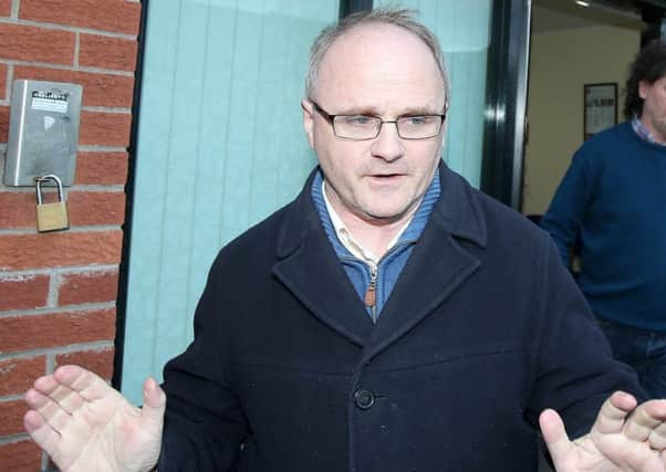 Barry McElduff pictured leaving Sinn Fein's office on the Falls Road in west Belfast on Monday