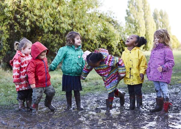 Children take part in a Muddy Puddle Walk to raise money for Save the Children's life-saving work.