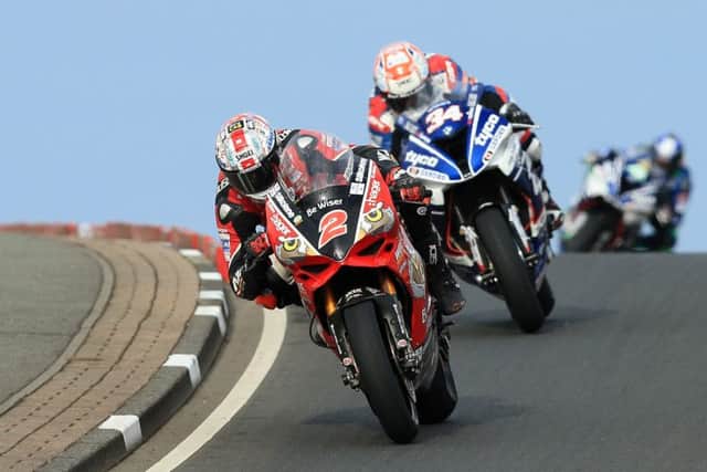 Glenn Irwin (Be Wiser/PBM Ducati) leads Alastair Seeley (Tyco BMW) during the feature Superbike race at the North West 200.