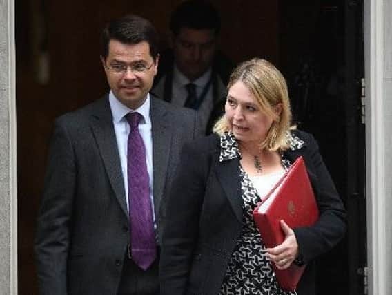 Outgoing Secretary of State James Brokenshire with his replacement, Karen Bradley