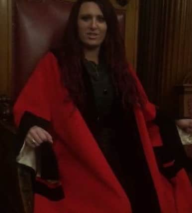 Britain First deputy leader Jayda Fransen in council robes in council chambers in Belfast