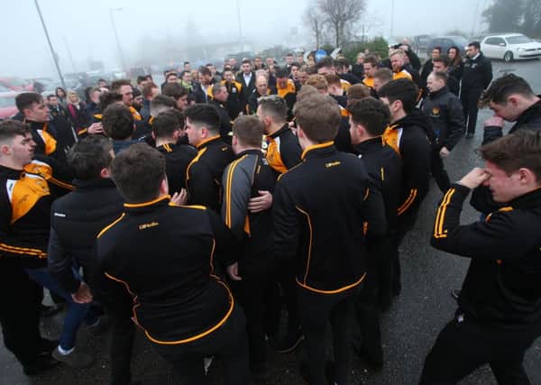 A crowd of mourners at the funeral of Christopher Colhoun yesterday