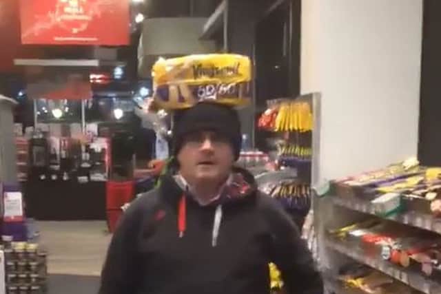 Barry McElduff pictured with a loaf of Kingsmill bread on his head on the anniversary of the Kingsmill massacre