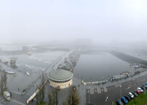 A panoramic view on to Belfast's River Lagan as thick fog falls on the city on Wednesday