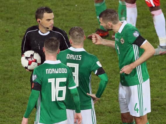 Gareth McAuley questions referee Ovidiu Hategan's decision in the first leg play-off