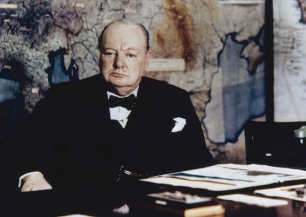Winston Churchill at his desk in the No 10 Annexe Map Room near the end of World War II