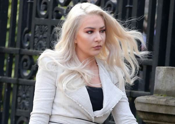 Model Laura Lacole goes into the High Court in Belfast on Monday