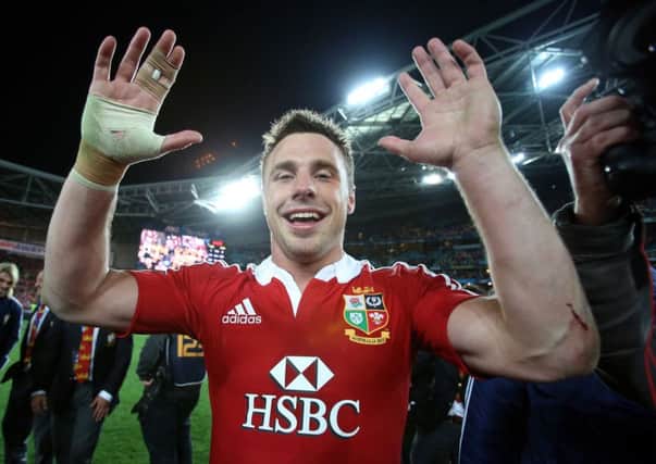 Tommy Bowe celebrates after the Lions secure a Test series win over Australia, his right hand still bandaged having fractured it a few weeks earlier