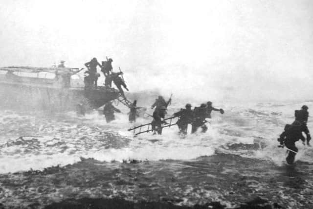 'Mad Jack' Churchill (far right) leads a training exercise, sword in hand, from a landing craft
